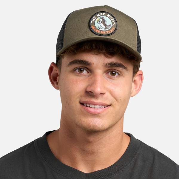 Man wearing a green cap with a logo on a white background