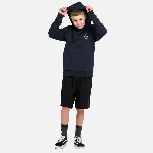 Child wearing a navy hoodie and black shorts on a white background