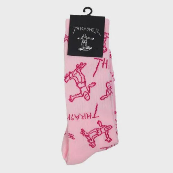 Pink socks with red graphics and a black tag on a light gray background