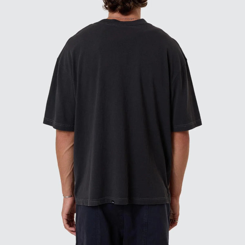 Person wearing a black t-shirt on a white background