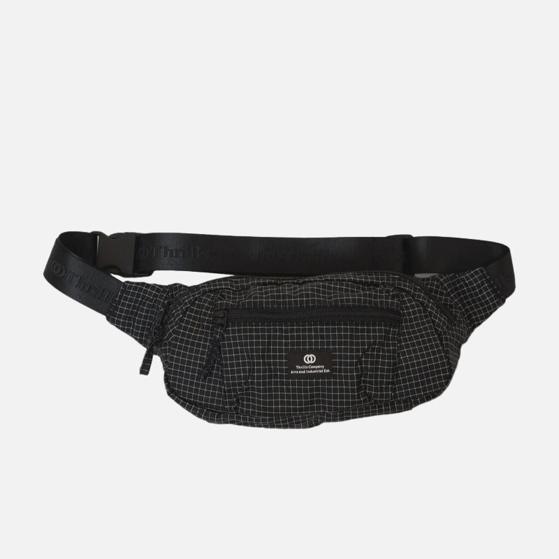 Black waist bag with grid pattern on a light gray background