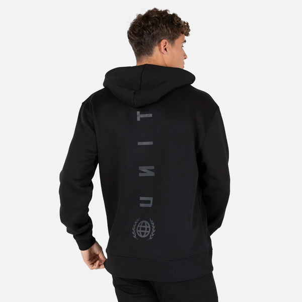 Person wearing a black hoodie with branding on the back against a light gray background