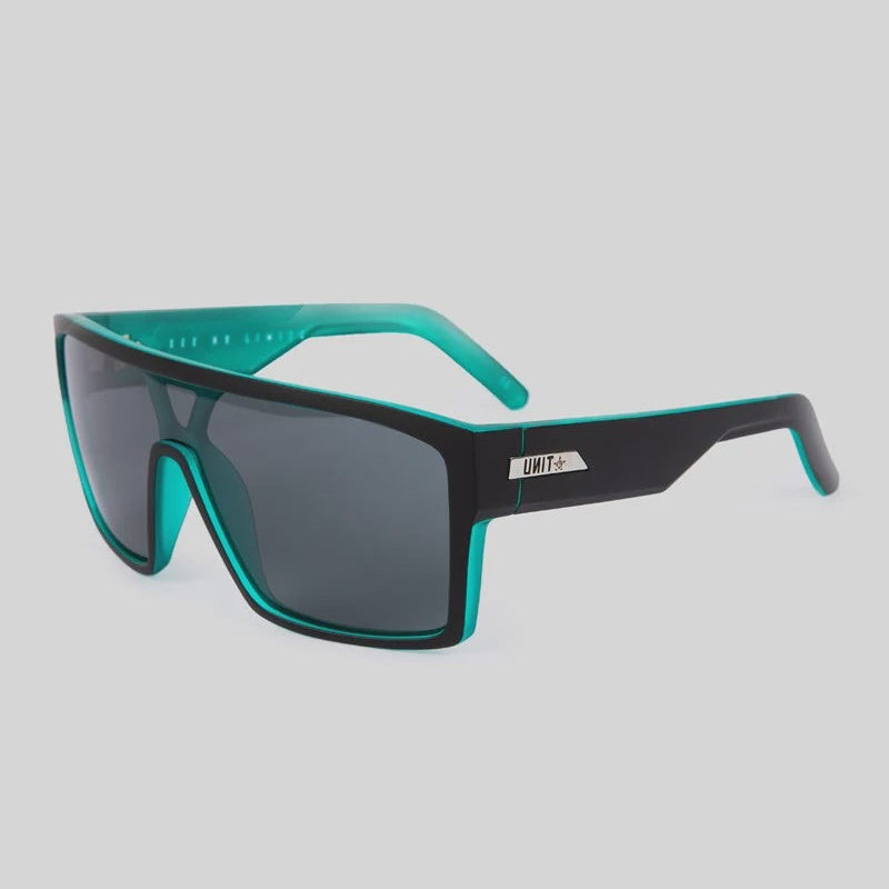 Sunglasses with black and teal frame on a light gray background