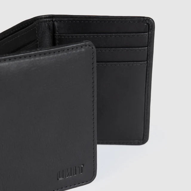 Black leather wallet on a black background