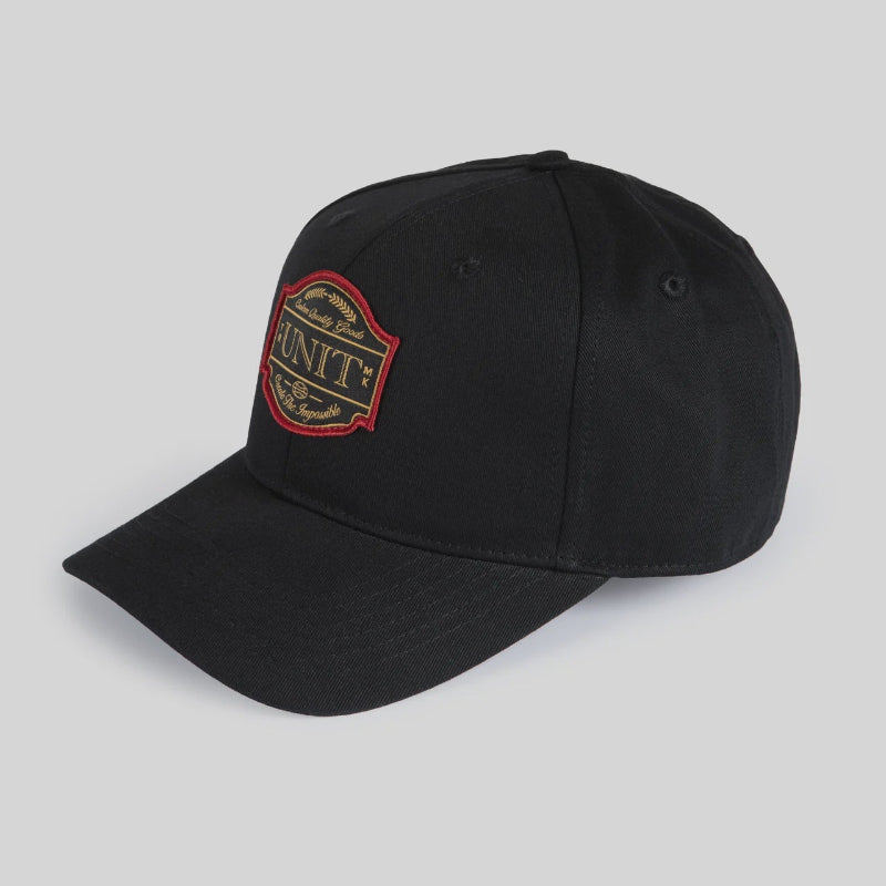 Black cap with a small logo on a light gray background