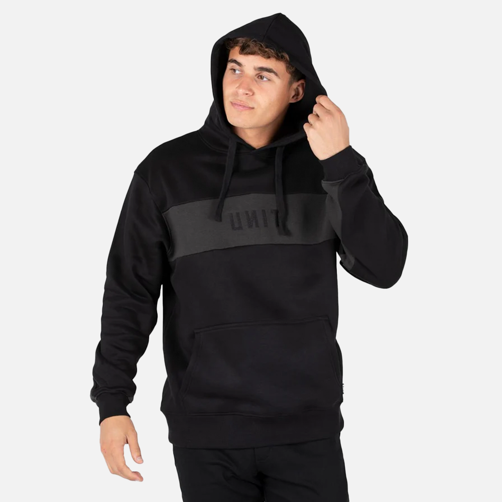Person wearing a black hoodie with a gray chest panel on a white background