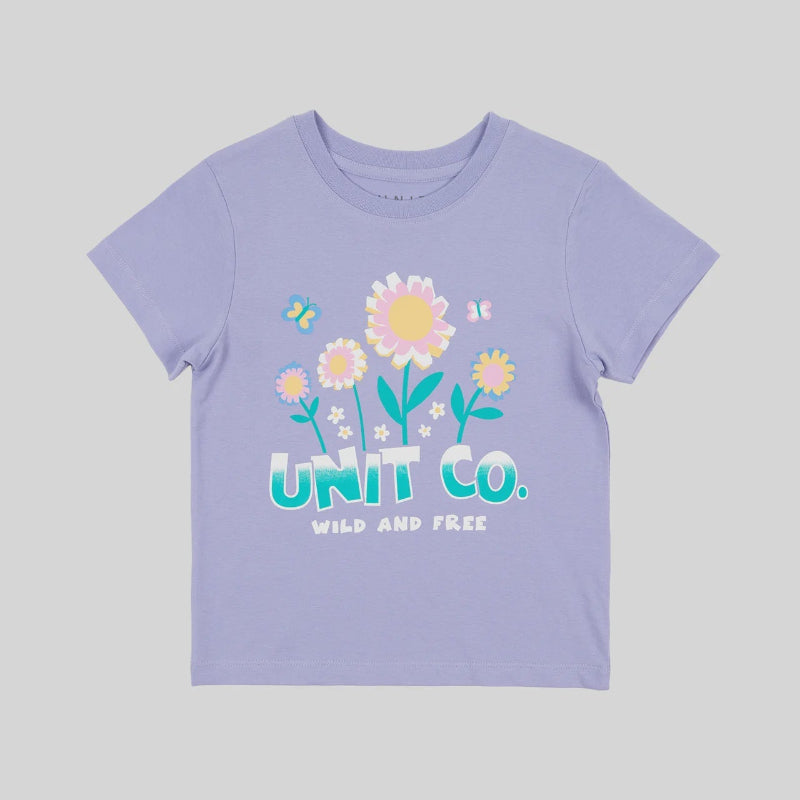 A light purple short-sleeve t-shirt with a colorful graphic of flowers, a butterfly, and the text 'UNIT CO. WILD AND FREE' on the front, displayed against a solid gray background.