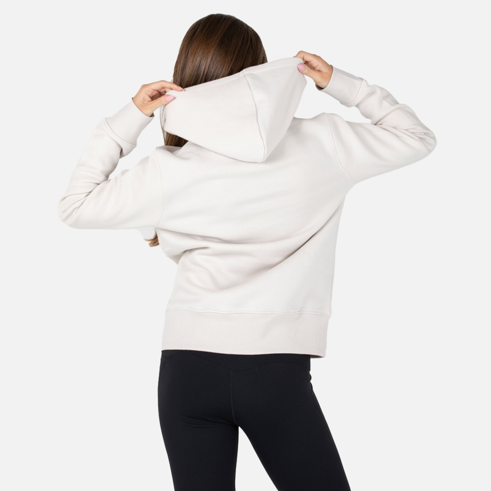 Person wearing a white hoodie with the hood up on a plain background