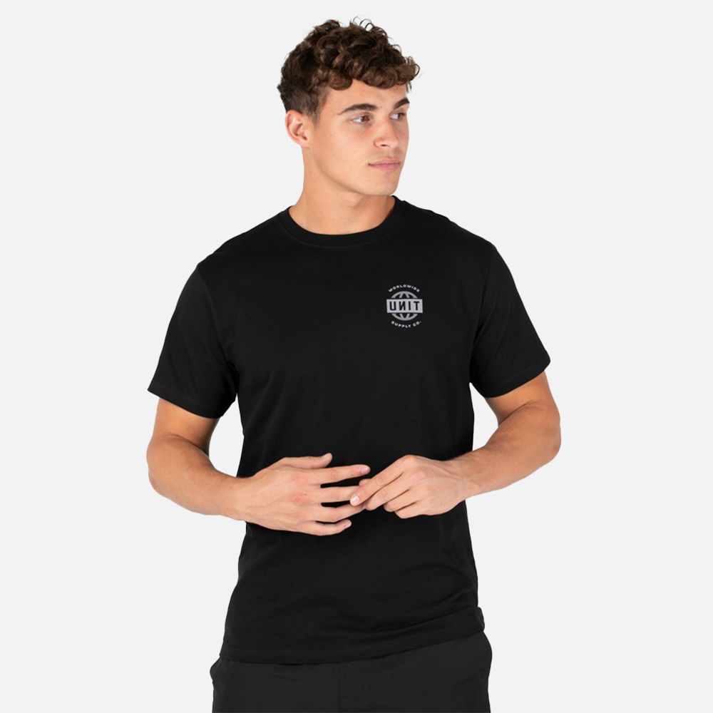 Man wearing a black t-shirt with a unit logo on a white background