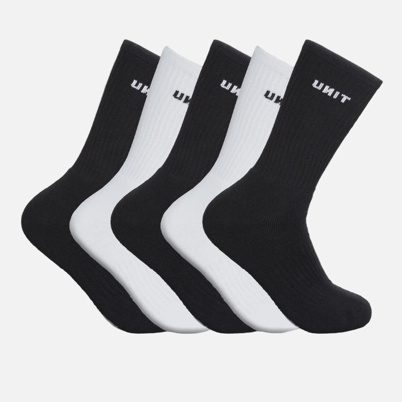 Set of black and white socks with 'UNIT' branding on a gray background