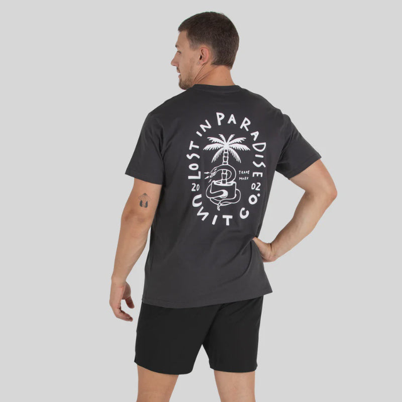 Man wearing a black t-shirt with a graphic design on the back against a gray background