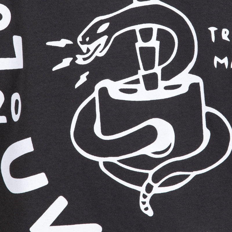 Black t-shirt with white snake design and text on a dark background