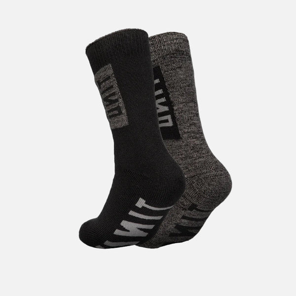 Two pairs of black and gray socks on a light gray background