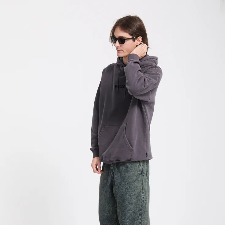 Person wearing a dark gray hoodie and pants on a white background