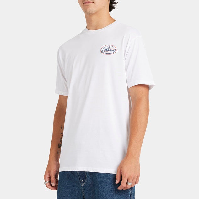 Person wearing a white t-shirt with a logo on a plain background