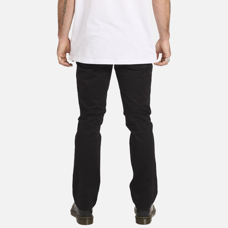 Person wearing black pants and a white shirt on a white background
