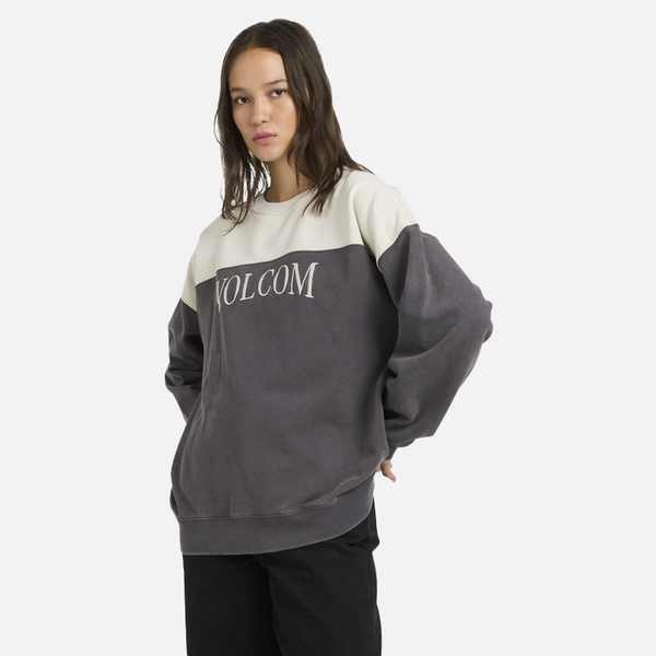 Person wearing a Volcom sweatshirt on a white background