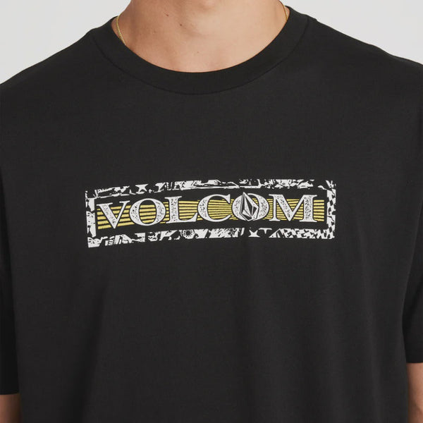 Black t-shirt with Volcom logo on a gray background