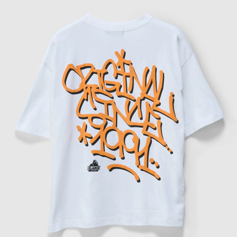 White t-shirt with orange graffiti-style text on a light gray background