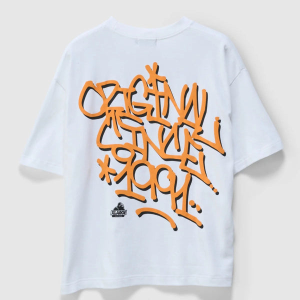 White t-shirt with orange graffiti-style text on a light gray background